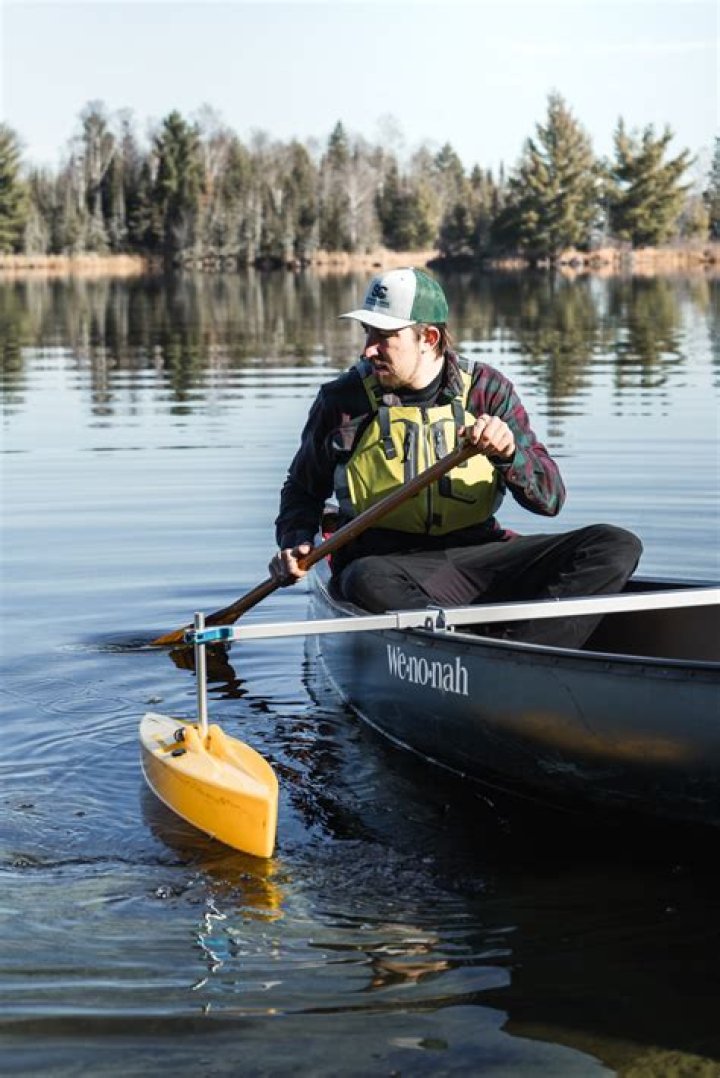 Implement for propelling a canoe