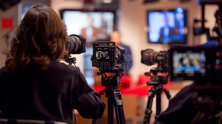 Off-camera staff on a television set