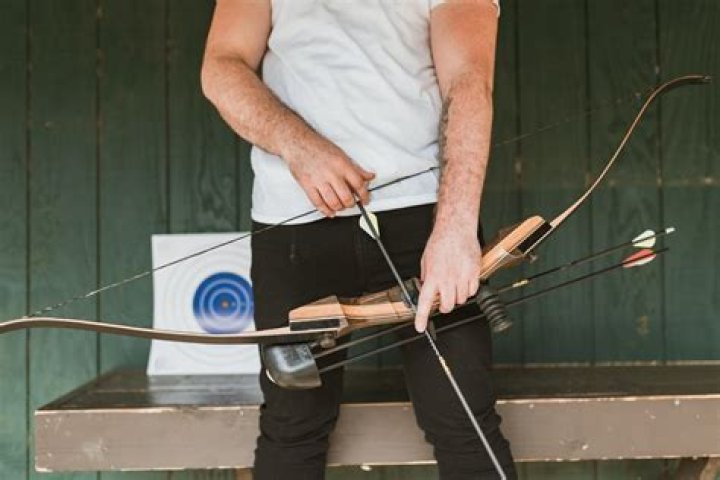 Prepare to fire as a bow