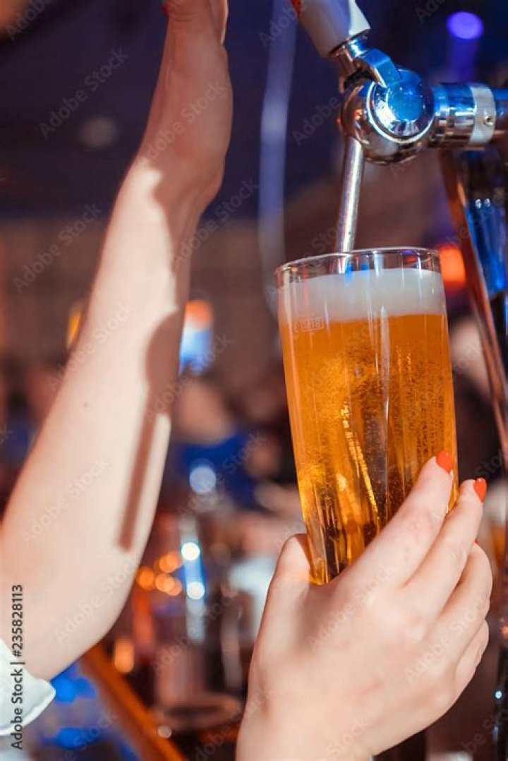 Spigots a bartender pours beer from