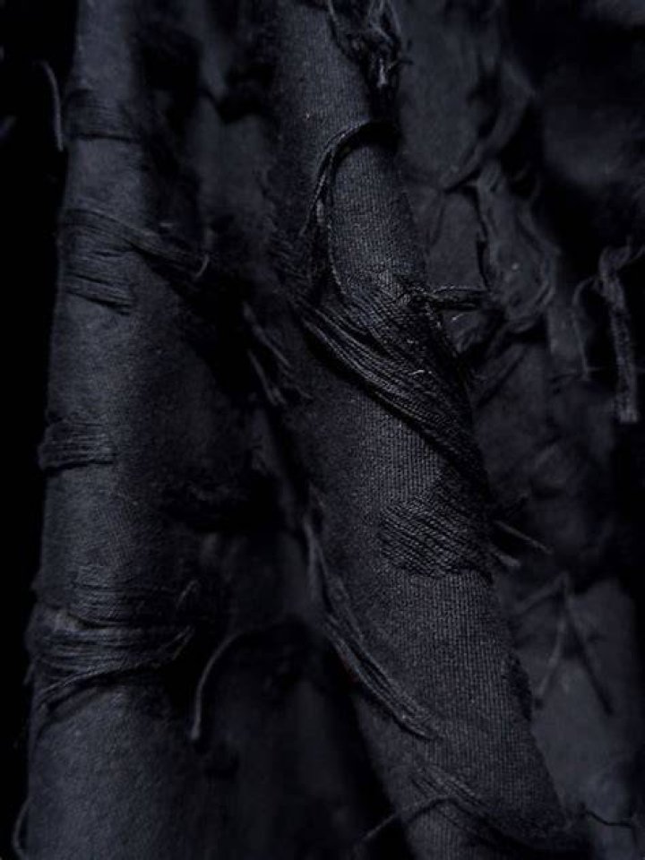 Tattered and ___ (in bad shape)